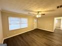 Bright living room with modern flooring, neutral walls, and ample natural light at 3609 Croft Nw Pl, Atlanta, GA 30331