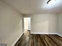 Spacious living room boasts wood-look flooring, neutral walls, and modern lighting at 2193 Polar Rock Sw Ave, Atlanta, GA 30315