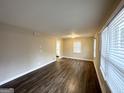 Spacious living room with hardwood floors, neutral walls, and plenty of natural light from the windows at 2544 Brentwood Rd, Decatur, GA 30032