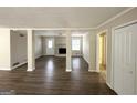 Spacious living room with neutral walls, updated floors, and a cozy fireplace at 3976 Bright Star Rd, Douglasville, GA 30135