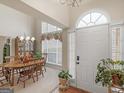 Inviting dining area with natural light, chandelier, and ample space for entertaining at 506 Olivia Ct, Stockbridge, GA 30281