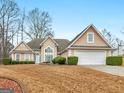 Charming single-Gathering home with manicured lawn, two-car garage and traditional architectural style at 506 Olivia Ct, Stockbridge, GA 30281