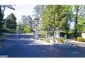 View of the community entrance with wrought iron gates and fountain at 2119 Pine Heights Ne Dr, Atlanta, GA 30324