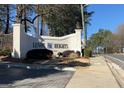 View of the Lenox Heights Condominiums community sign with healthy landscaping at 2119 Pine Heights Ne Dr, Atlanta, GA 30324