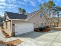 New construction home with white garage door and concrete driveway at 3392 Milan Ct # 2 Plapprox Sqft 3, Douglasville, GA 30135