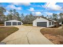 Large driveway leading to the house and detached three-car garage at 225 Highway 212 S, Covington, GA 30014