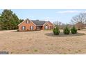 Inviting single-story brick home featuring manicured landscaping and a spacious front yard at 234 Thorne Wood Ln, Hampton, GA 30228