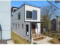 Modern home with a rooftop deck, minimalist railings and a cozy covered front porch at 567 Middle Sw St, Atlanta, GA 30310