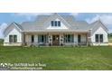 Inviting two-story modern farmhouse with charming front porch and large manicured lawn at 0 Lot 2 Mcbride Rd, Fayetteville, GA 30215