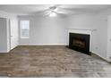 Spacious living room featuring wood-look floors and a classic fireplace at 61 Barrington Pl, Marietta, GA 30066