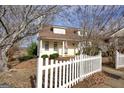 Beautiful two-story house featuring dormer windows and a charming white picket fence at 2683 Mariner Way, Villa Rica, GA 30180