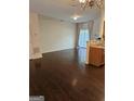 Bright living room with hardwood floors and sliding glass doors leading to the outside at 2764 Keystone Ave, Lithonia, GA 30058