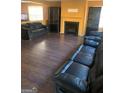 Spacious living room with hardwood floors, fireplace, and dark cabinets, creating a cozy atmosphere at 5620 Sable Way, Atlanta, GA 30349