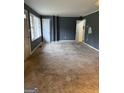 Spacious living room featuring carpet floors and neutral walls, offering a versatile living space at 392 Carey Se Dr, Atlanta, GA 30315