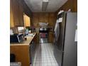 Functional kitchen with stainless steel appliances and ample storage at 9055 Kelly Ct, Jonesboro, GA 30236