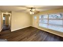 Bright living room boasts hardwood floors, ceiling fan, and a well-lit and comfortable atmosphere at 2004 Shamrock Dr, Decatur, GA 30032