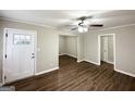 Open-concept living room featuring hardwood floors, closet, and a ceiling fan at 3011 Belvedere Ln, Decatur, GA 30032