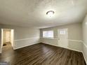 Inviting living area with wood-look floors and neutral color scheme at 3711 Tulip Dr, Decatur, GA 30032