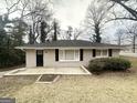 Inviting single-story brick home with a well-maintained lawn and classic architectural details at 105 Hillside Se Ave, Atlanta, GA 30315