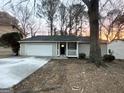 Charming single-story home with a garage and welcoming front porch at 5468 Pepperwood Ct, Stone Mountain, GA 30087