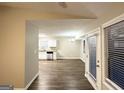 Open floor plan with hardwood floors connecting living and dining areas at 5468 Pepperwood Ct, Stone Mountain, GA 30087