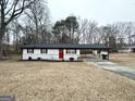 Well-maintained single-story home with a carport and dormant yard ready for the spring season at 3507 Sage Dr, Lithia Springs, GA 30122