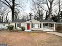 Inviting single-story home featuring a classic design with a carport and a brick exterior at 2174 Doris Dr, Decatur, GA 30034