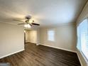 Bright living room with hardwood floors, a ceiling fan, and neutral paint at 2174 Doris Dr, Decatur, GA 30034