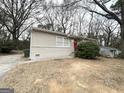 Traditional home with a brick foundation and a tidy front yard at 312 Fairburn Nw Rd, Atlanta, GA 30331