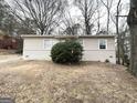 Cozy home with brick accents and a mature bush in the front yard at 312 Fairburn Nw Rd, Atlanta, GA 30331
