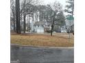 Suburban home on a corner lot with a two-car garage and a mix of brick and light-colored siding at 10020 Crystal Ter, Jonesboro, GA 30238