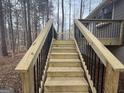 New wood steps leading to the deck off the back of this lovely home at 115 Paces Way, Fayetteville, GA 30215