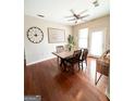 Dining area boasts hardwood floors, natural light, a ceiling fan and a wooden table with chairs at 870 Nw Mayson Turner Nw Rd # 1227, Atlanta, GA 30314