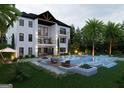 Luxurious backyard featuring a shimmering pool, elegant lounge area, and lush greenery, perfect for relaxation at 532 Saint Sambar Dr, Ellenwood, GA 30294