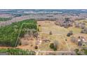 Land outline shows the property's acreage and surrounding wooded landscape at 62 Honey Ln, Mcdonough, GA 30252