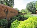 Oak Park neighborhood entrance sign surrounded by lush greenery at 135 Oakpark Ter, Mcdonough, GA 30253