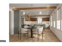 Bright kitchen and dining area with modern pendant lighting and updated appliances, offering a stylish and functional space at 60 Douglas Se St, Atlanta, GA 30317