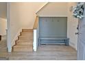 Inviting foyer with a staircase, coat rack, and durable flooring at 101 Nightwind Ct, Peachtree City, GA 30269