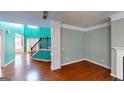 Bright living room with hardwood floors, stairs, and unique color scheme at 100 Windmeadow Way, Fayetteville, GA 30214