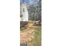 Fenced backyard with space and a mix of grass and mulch at 801 Winbrook Dr, Mcdonough, GA 30253