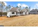 Attractive new construction with a mix of stone and siding, blending seamlessly into landscape at 130 Windchime Way # 9, Tyrone, GA 30290