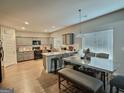Spacious kitchen with granite countertops, stainless steel appliances, and a dining area at 3092 Cedar Crest Way, Decatur, GA 30034