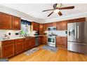 Well-equipped kitchen featuring stainless steel appliances and wood cabinetry at 230 Wyngate Cir, Fayetteville, GA 30215
