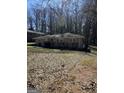 Charming ranch-style home featuring a well-kept lawn and mature trees at 1988 Bencal Se Dr, Atlanta, GA 30316