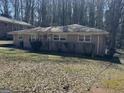 Charming ranch-style home featuring a well-kept lawn and mature trees at 1988 Bencal Se Dr, Atlanta, GA 30316