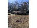 Charming ranch-style home featuring a well-kept lawn and mature trees at 1988 Bencal Se Dr, Atlanta, GA 30316