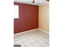 Bedroom featuring tile floors, a red wall and a window at 287 Henry Aaron Sw Ave, Atlanta, GA 30310