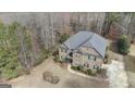 Aerial view of a beautiful two-story home, showcasing its roof, landscaping, and driveway at 1110 Eagles Brooke, Locust Grove, GA 30248