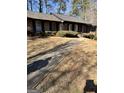 View of the front yard with a sidewalk leading to the front door of a traditional single-story home at 1125 Carlo Sw Ct, South Fulton, GA 30331