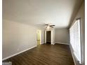 Bright living room with vinyl floors, ceiling fan, and neutral paint at 4734 Campbellton Sw Rd, Atlanta, GA 30331
